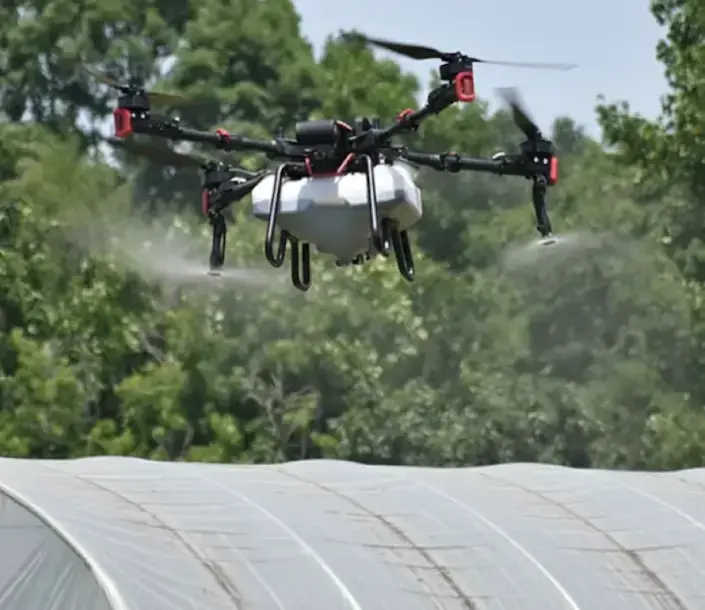 XAG drone cleaning a polytunnel roof
