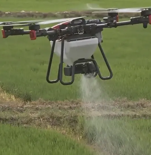XAG p100 Drone spreading product over young wheat field