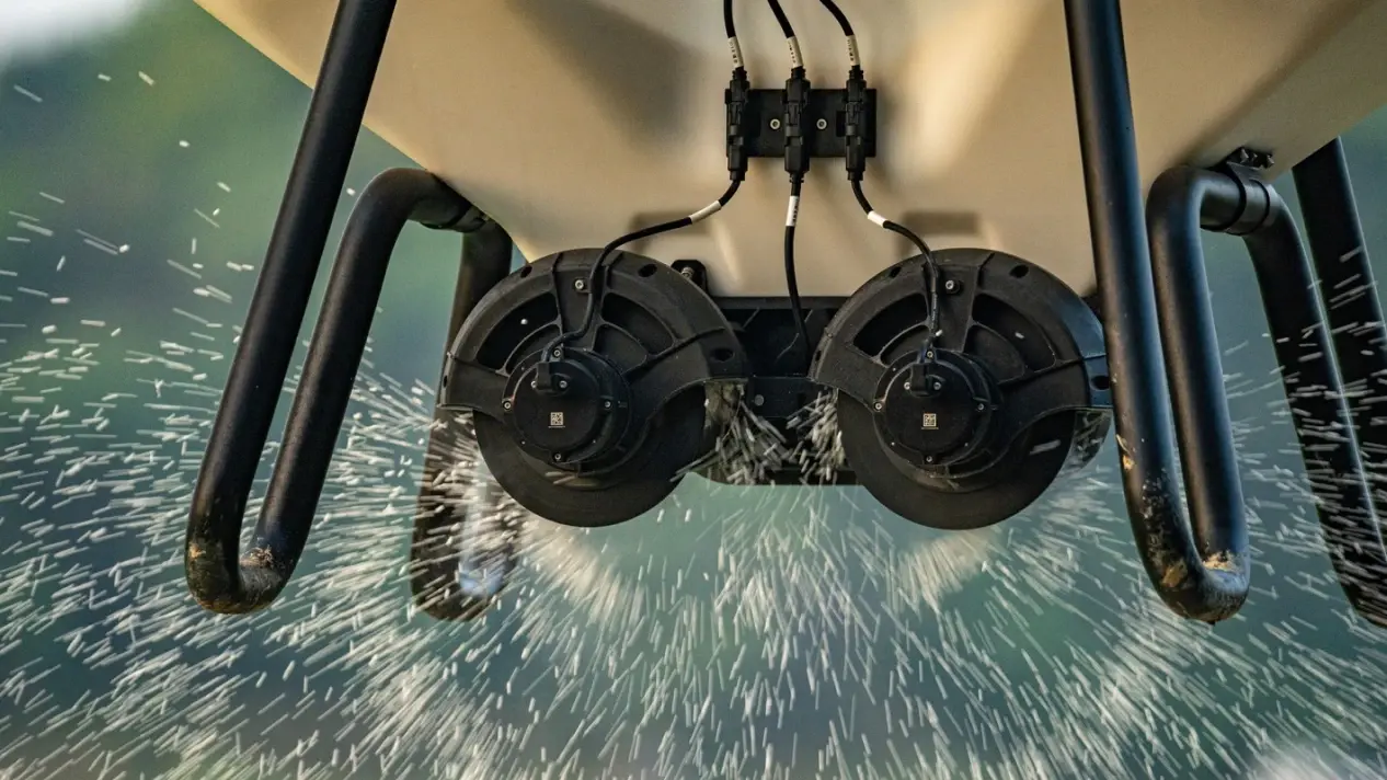 Rotor downwash drives spray deep into the crop canopy.