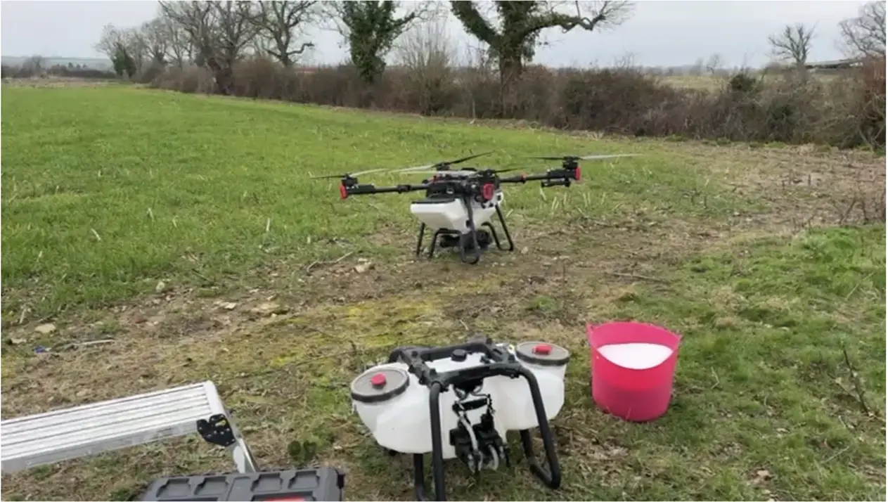 XAG P100 spreads hovers over a field.